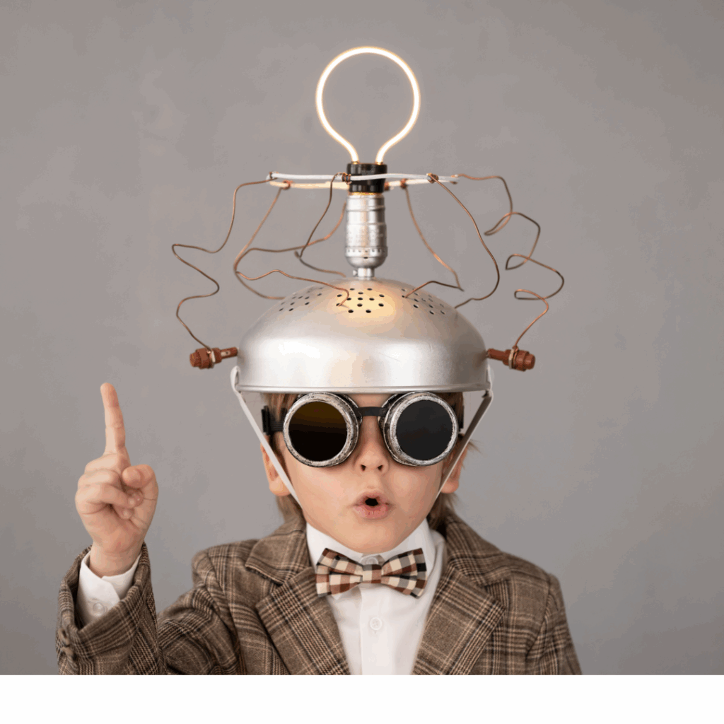Little boy in a bowtie with a electronic device on his head to help him think