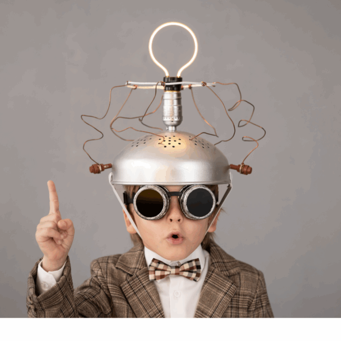 Little boy in a bowtie with a electronic device on his head to help him think