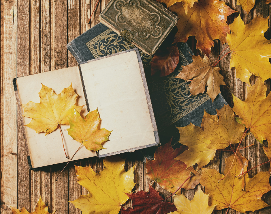 Journal open with yellow fall leaves in the pages