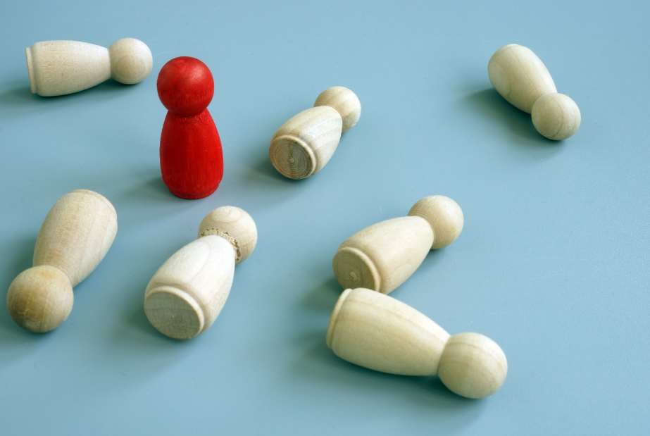 Red peg standing up with white pegs tipped over